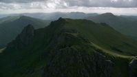 5.5K stock footage aerial video of orbiting green mountain peak, The Cobbler, Scottish Highlands, Scotland Aerial Stock Footage | AX110_076