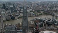 5.5K stock footage aerial video of orbiting The Shard to reveal Tower Bridge over River Thames, London, England Aerial Stock Footage | AX114_022
