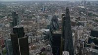 5.5K stock footage aerial video orbit tall skyscraper to reveal The Gherkin, Central London, England Aerial Stock Footage | AX114_026