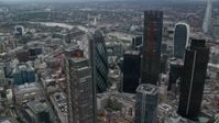 5.5K stock footage aerial video of orbiting The Gherkin and Heron Tower skyscrapers, Central London, England Aerial Stock Footage | AX114_028
