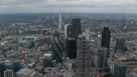 5.5K stock footage aerial video orbiting Gherkin and Heron Tower, reveal The Shard in London, England Aerial Stock Footage | AX114_029