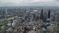 5.5K stock footage aerial video of River Thames between skyscrapers and The Shard, Central London, England Aerial Stock Footage | AX114_032