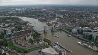 5.5K stock footage aerial video approach Tower of London and the Tower Bridge over River Thames, England Aerial Stock Footage | AX114_049