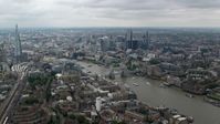 5.5K stock footage aerial video approach Tower Bridge spanning River Thames by Central London skyscrapers, England Aerial Stock Footage | AX114_057