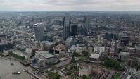 5.5K stock footage aerial video of approaching skyscrapers from River Thames, Central London, England Aerial Stock Footage | AX114_060
