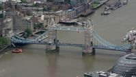 5.5K stock footage aerial video of light traffic on Tower Bridge spanning the River Thames, London, England Aerial Stock Footage | AX114_081
