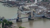5.5K stock footage aerial video of orbiting Tower Bridge spanning River Thames, London, England Aerial Stock Footage | AX114_084