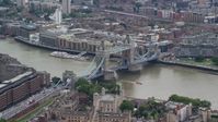 5.5K stock footage aerial video of orbiting Tower Bridge and Tower of London, England Aerial Stock Footage | AX114_086