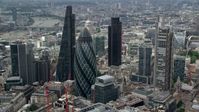 5.5K stock footage aerial video of orbiting around The Gherkin and city skyscrapers, Central London, England Aerial Stock Footage | AX114_106