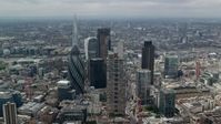 5.5K stock footage aerial video orbiting group of skyscrapers, The Shard in the background, Central London, England Aerial Stock Footage | AX114_109