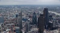 5.5K stock footage aerial video orbiting Central London skyscrapers and city sprawl, England Aerial Stock Footage | AX114_113