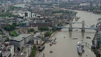 5.5K stock footage aerial video of historic Tower of London, and Tower Bridge on River Thames, England Aerial Stock Footage | AX114_116
