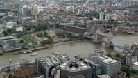 5.5K stock footage aerial video of Tower of London near the Tower Bridge and River Thames, England Aerial Stock Footage | AX114_119