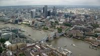 5.5K stock footage aerial video wide view of Tower Bridge near Tower of London and Central London skyscrapers, England Aerial Stock Footage | AX114_123