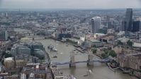 5.5K stock footage aerial video of flying away from Tower Bridge and River Thames, England Aerial Stock Footage | AX114_125