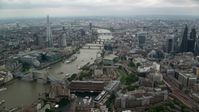 5.5K stock footage aerial video of approaching bridges over the River Thames and The Shard skyscraper in London, England Aerial Stock Footage | AX114_159