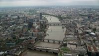 5.5K stock footage aerial video of flying over bridges spanning the River Thames, London, England Aerial Stock Footage | AX114_162