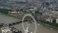 5.5K stock footage aerial video of approach Big Ben and Parliament from the London Eye, England Aerial Stock Footage | AX114_185