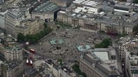 5.5K stock footage aerial video of orbiting Trafalgar Square, London, England Aerial Stock Footage | AX114_200