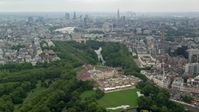 5.5K stock footage aerial video of Buckingham Palace and London cityscape, England Aerial Stock Footage | AX114_214