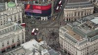 5.5K stock footage aerial video of circling buses and tourists at Piccadilly Circus, London, England Aerial Stock Footage | AX114_239