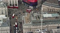 5.5K stock footage aerial video orbiting traffic at Piccadilly Circus in London, England Aerial Stock Footage | AX114_240