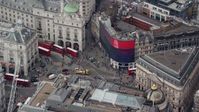 5.5K stock footage aerial video of an orbit around buses and traffic at Piccadilly Circus, London, England Aerial Stock Footage | AX114_241