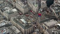 5.5K stock footage aerial video of Piccadilly Circus with tourists and buses, London, England Aerial Stock Footage | AX114_242