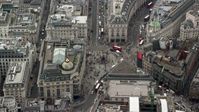 5.5K stock footage aerial video of Piccadilly Circus with tourists and buses, London, England Aerial Stock Footage | AX114_243