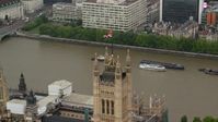 5.5K stock footage aerial video of an orbit of the British Flag on Parliament along River Thames, London England Aerial Stock Footage | AX115_102