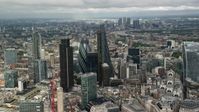 5.5K stock footage aerial video circle skyscrapers surrounded by city sprawl in Central London, England Aerial Stock Footage | AX115_157