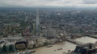 5.5K stock footage aerial video of a wide orbit of The Shard and cityscape, London, England Aerial Stock Footage | AX115_177