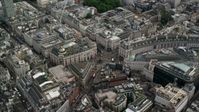 5.5K stock footage aerial video of flying by Piccadilly Circus with traffic and tourists, London, England Aerial Stock Footage | AX115_210