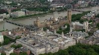 5.5K stock footage aerial video approach Big Ben, Parliament and government offices on the Thames, London, England Aerial Stock Footage | AX115_212