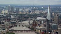 5.5K stock footage aerial video of The Shard, Tower Bridge and Canary Wharf in London, England Aerial Stock Footage | AX115_248