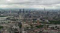 5.5K stock footage aerial video of the cityscape, the London Eye, and Parliament, England Aerial Stock Footage | AX115_256