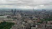 5.5K stock footage aerial video of a wide view of the London cityscape from Parliament and London Eye, England Aerial Stock Footage | AX115_257