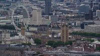 5.5K stock footage aerial video of flying by Big Ben, Parliament and London Eye, England Aerial Stock Footage | AX115_270