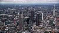 5.5K stock footage aerial video orbit skyscrapers, The Shard near River Thames, London, England, twilight Aerial Stock Footage | AX116_015