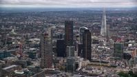 5.5K stock footage aerial video of skyscrapers, with The Shard in distance, London, England, twilight Aerial Stock Footage | AX116_016