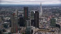 5.5K stock footage aerial video approach skyscrapers, with The Shard in the distance, London England, twilight Aerial Stock Footage | AX116_017