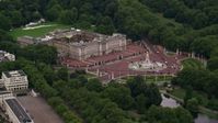 5.5K stock footage aerial video of approaching Buckingham Palace and Victoria Memorial, London, England, twilight Aerial Stock Footage | AX116_028