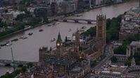 5.5K stock footage aerial video of flying by Big Ben and British Parliament on River Thames, London, England, twilight Aerial Stock Footage | AX116_059