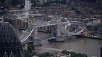 5.5K stock footage aerial video flyby Tower Bridge spanning River Thames, reveal The Gherkin, London, England, twilight Aerial Stock Footage | AX116_089