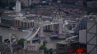 5.5K stock footage aerial video flyby Heron Tower, revealing Tower Bridge in London, England, twilight Aerial Stock Footage | AX116_090