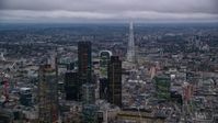 5.5K stock footage aerial video flyby skyscrapers and cityscape, The Shard in background, London, England, twilight Aerial Stock Footage | AX116_091