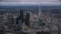 5.5K stock footage aerial video of skyscrapers and cityscape, with The Shard in background, London, England, twilight Aerial Stock Footage | AX116_092