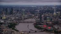 5.5K stock footage aerial video of bridges over River Thames, skyscrapers and cityscape, London, England, night Aerial Stock Footage | AX116_107