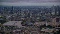 5.5K stock footage aerial video tall skyscrapers and River Thames bridges, reveal London Eye, London, England, night Aerial Stock Footage | AX116_113