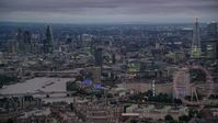 5.5K stock footage aerial video of skyscrapers, and River Thames bridges seen from London Eye, London, England, night Aerial Stock Footage | AX116_114